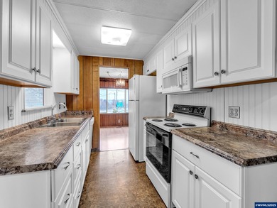 Well-Maintained Home in 55+ Park. Fresh carpet in the front room