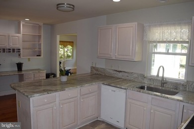 Nestled in the serene community of Captain's Cove, this is a - photo 11