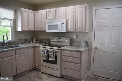Nestled in the serene community of Captain's Cove, this is a - photo 13