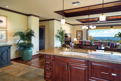 Perched above the shimmering coastline within the coveted - photo 9