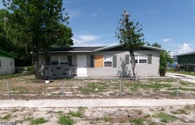 Bring your vision to this Fort Myers fixer-upper with a lot of - photo 1