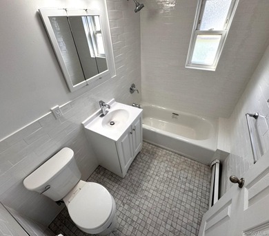 Beautifully updated two-family home in the Morris Park section - photo 12
