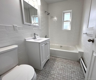 Beautifully updated two-family home in the Morris Park section - photo 14