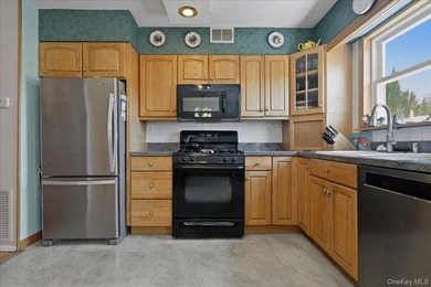 Well maintained three bedroom 1.5 bath triplex home with central - photo 12