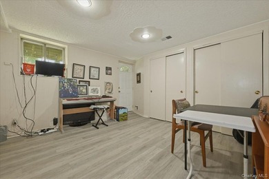 Well maintained three bedroom 1.5 bath triplex home with central - photo 18