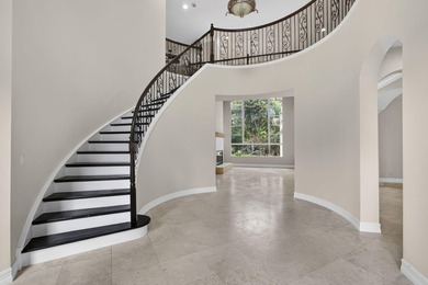 Located on a private cul-de-sac lakefront lot in the exclusive - photo 3