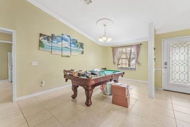 Private Florida resort-style brick home with screened pool - photo 13
