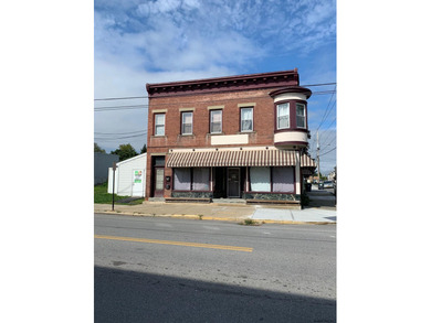Excellent opportunity in this mixed use building to run your - photo 2