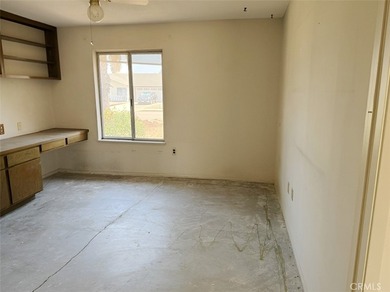 This 2-bedroom, 2-bathroom property offers genuine potential in - photo 3