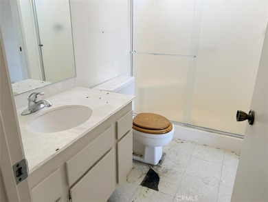 This 2-bedroom, 2-bathroom property offers genuine potential in - photo 7