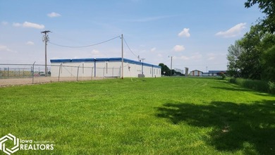 Former equipment dealership building on 1.27 acres at the west
