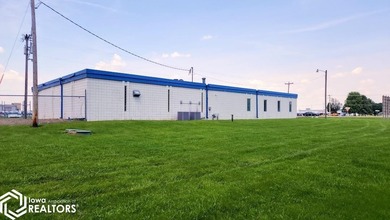 Former equipment dealership building on 1.27 acres at the west