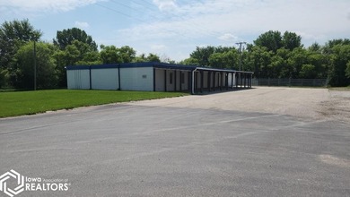 Former equipment dealership building on 1.27 acres at the west