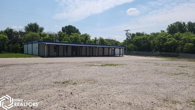 Former equipment dealership building on 1.27 acres at the west