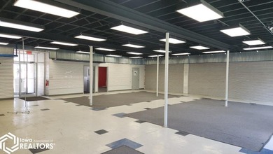 Former equipment dealership building on 1.27 acres at the west