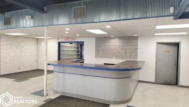 Former equipment dealership building on 1.27 acres at the west