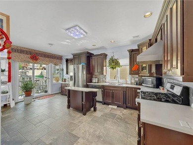 Built in 2013, this detached two-family home with brick front - photo 11