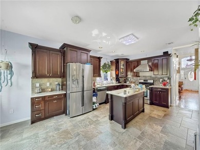 Built in 2013, this detached two-family home with brick front - photo 13