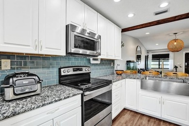 An updated and spacious corner villa in Forest Lake community at - photo 13