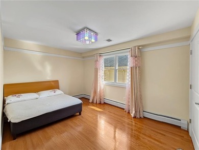 Built in 2013, this detached two-family home with brick front - photo 16