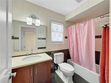 Built in 2013, this detached two-family home with brick front - photo 25