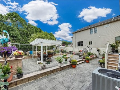 Built in 2013, this detached two-family home with brick front - photo 27