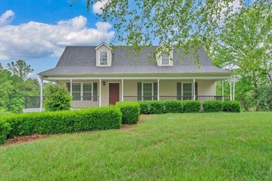 Nestled on 13.8 private acres with water frontage on beautiful - photo 1