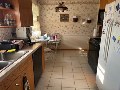 Handicap accessible two bedroom brick ranch! Newer walk-in