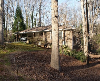 Welcome home to this beautiful, mid-century modern, 4-sided