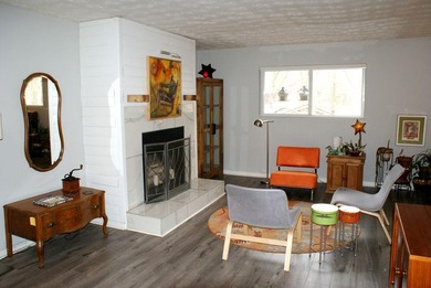 Welcome home to this beautiful, mid-century modern, 4-sided