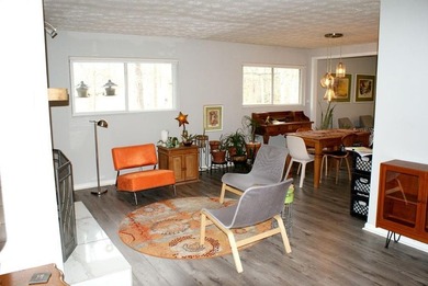 Welcome home to this beautiful, mid-century modern, 4-sided