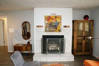 Welcome home to this beautiful, mid-century modern, 4-sided