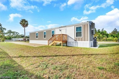Situated on over half an acre, this pristine three-bedroom - photo 1