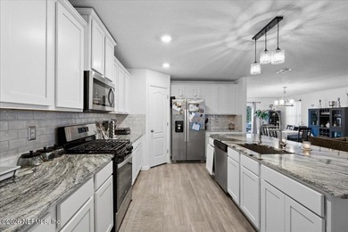 Sophisticated 4-bedroom, 3-bath residence in the desirable - photo 8