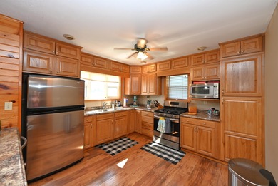 Immerse yourself in the beauty of lakefront living with this - photo 8