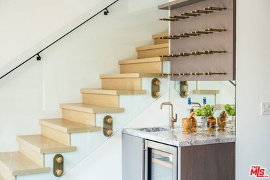 A refined coastal retreat awaits at this newly built modern - photo 12