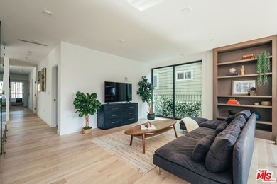 A refined coastal retreat awaits at this newly built modern - photo 16