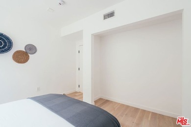 A refined coastal retreat awaits at this newly built modern - photo 24