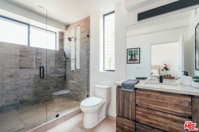 A refined coastal retreat awaits at this newly built modern - photo 26