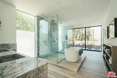 A refined coastal retreat awaits at this newly built modern - photo 33