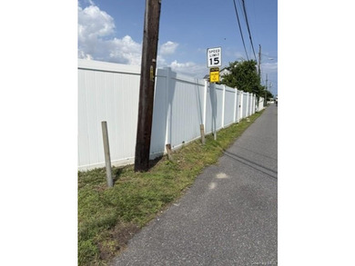 This compact, fully fenced lot offers a secure and practical - photo 5