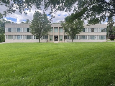 This three-story limestone office building totals approximately