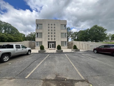 This three-story limestone office building totals approximately