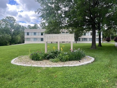 This three-story limestone office building totals approximately