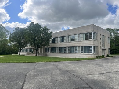 This three-story limestone office building totals approximately