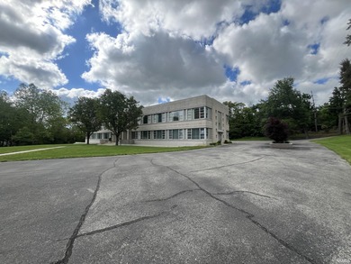 This three-story limestone office building totals approximately