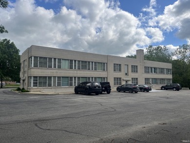 This three-story limestone office building totals approximately