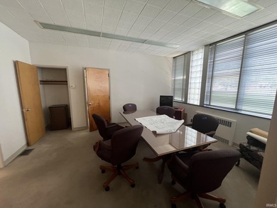 This three-story limestone office building totals approximately