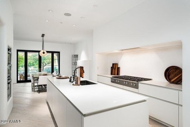 A uniquely tasteful ''lock 'n leave'' home with a crisp, clean - photo 11