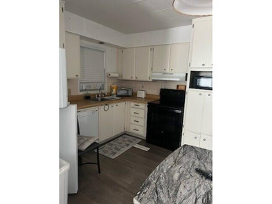 Charming manufactured home in Leisure Village, a well-maintained - photo 10